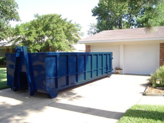 Dumpster Rentals in front house